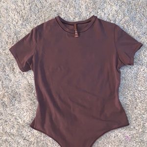 SKIMS Cotton Jersey T-Shirt Bodysuit in Garnet